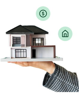 Mano sosteniendo una maqueta de casa moderna para la compra de vivienda